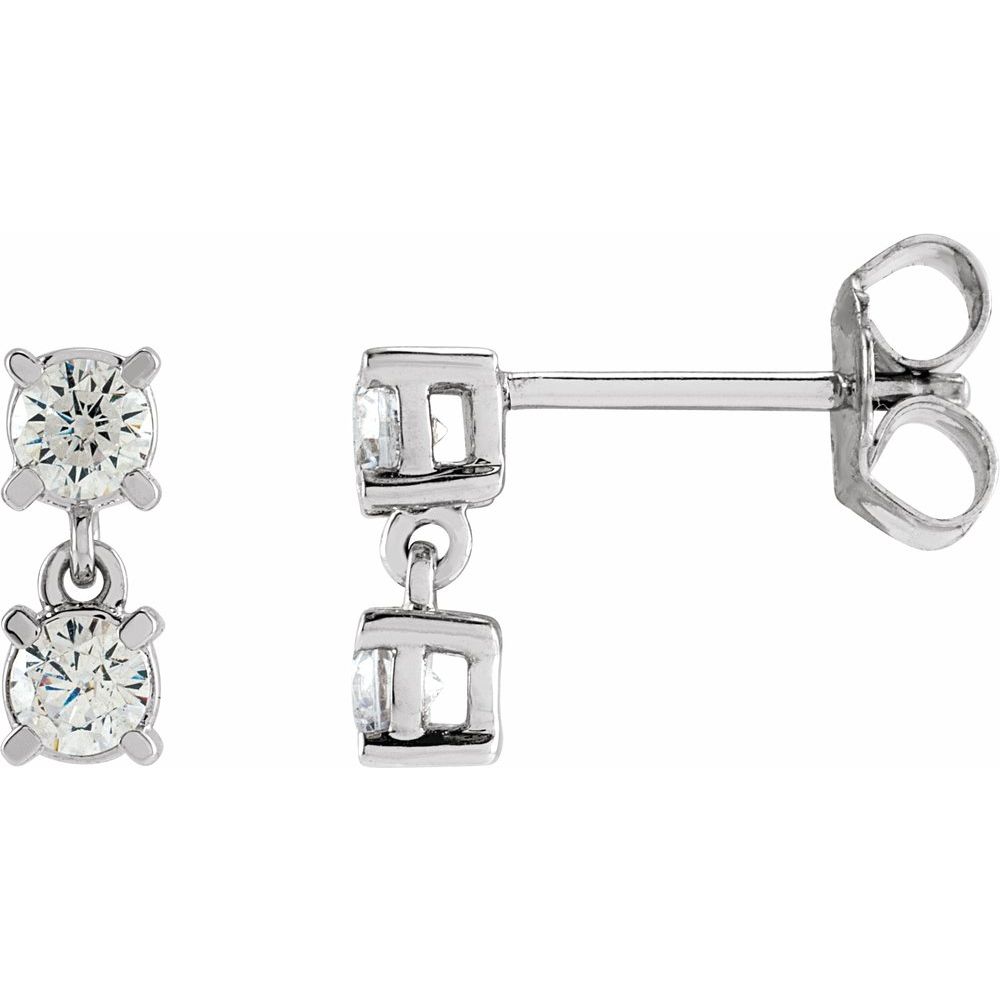 Pair of silver earrings with clear gemstones on a white background
